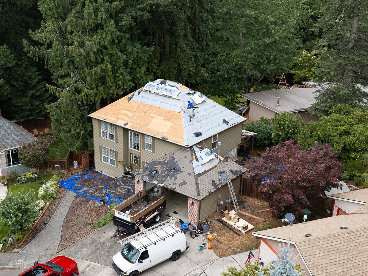 Aerial view of a two-story home roof replacement by Liberty in Sandy, OR