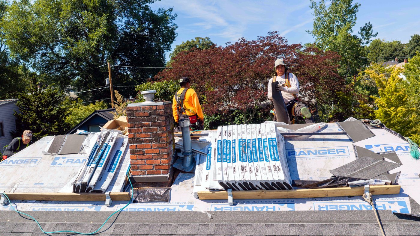 Liberty crew installing shingles on a roof replacement in the Pacific Northwest