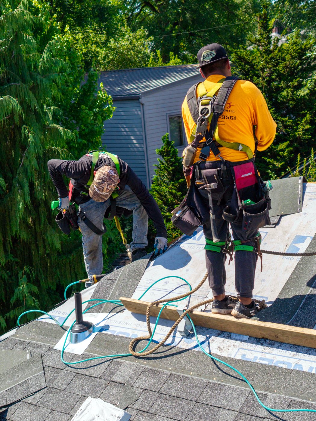 A Liberty roofer working safely on a roof in the Pacific Northwest
