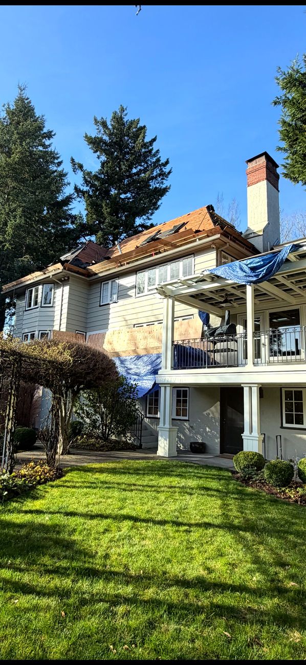 Storm-damaged roof tarped and secured for emergency repair in Vancouver, WA